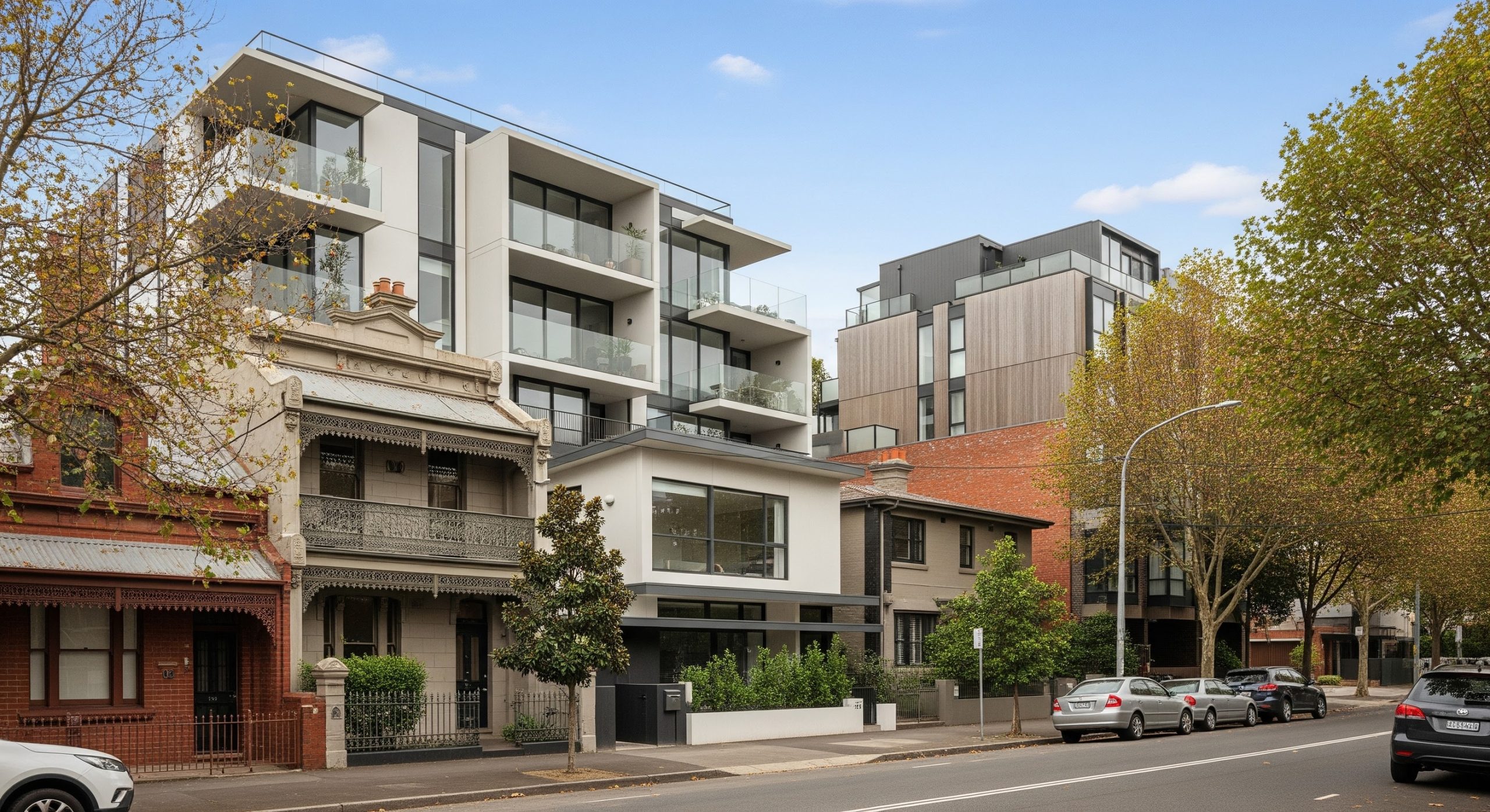 Modern workspace with market data and property charts representing expert analysis of the Melbourne real estate market.